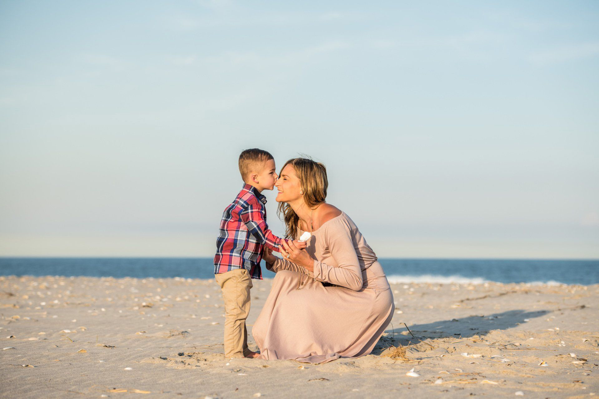 Dr. Kimberly and her young son on the beach.